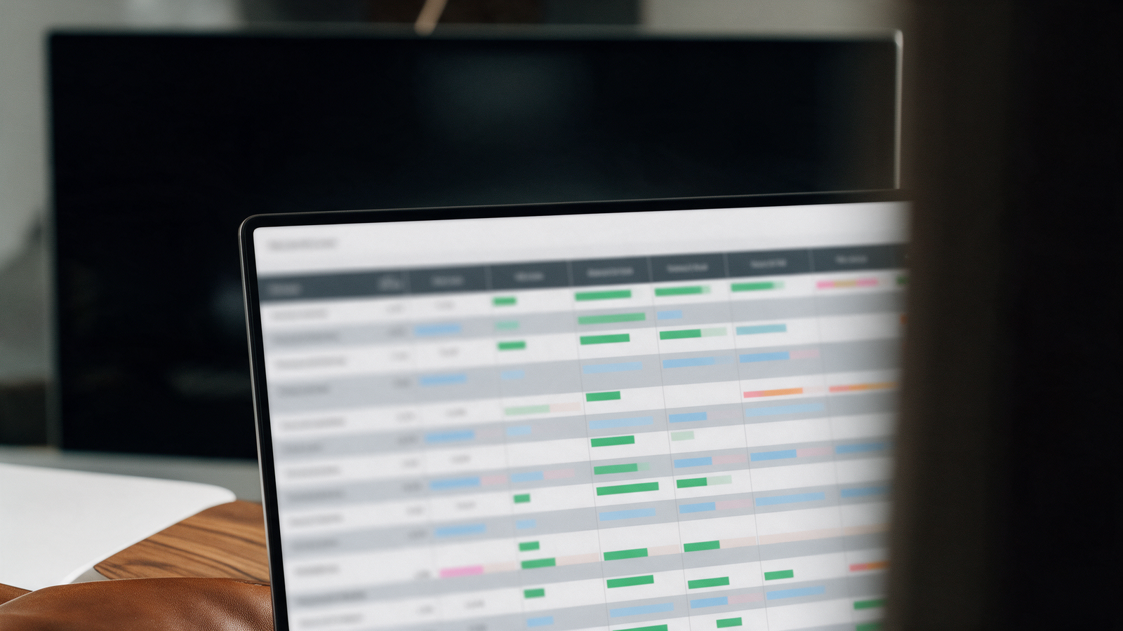 Laptop screen showing an abstract cap table spreadsheet