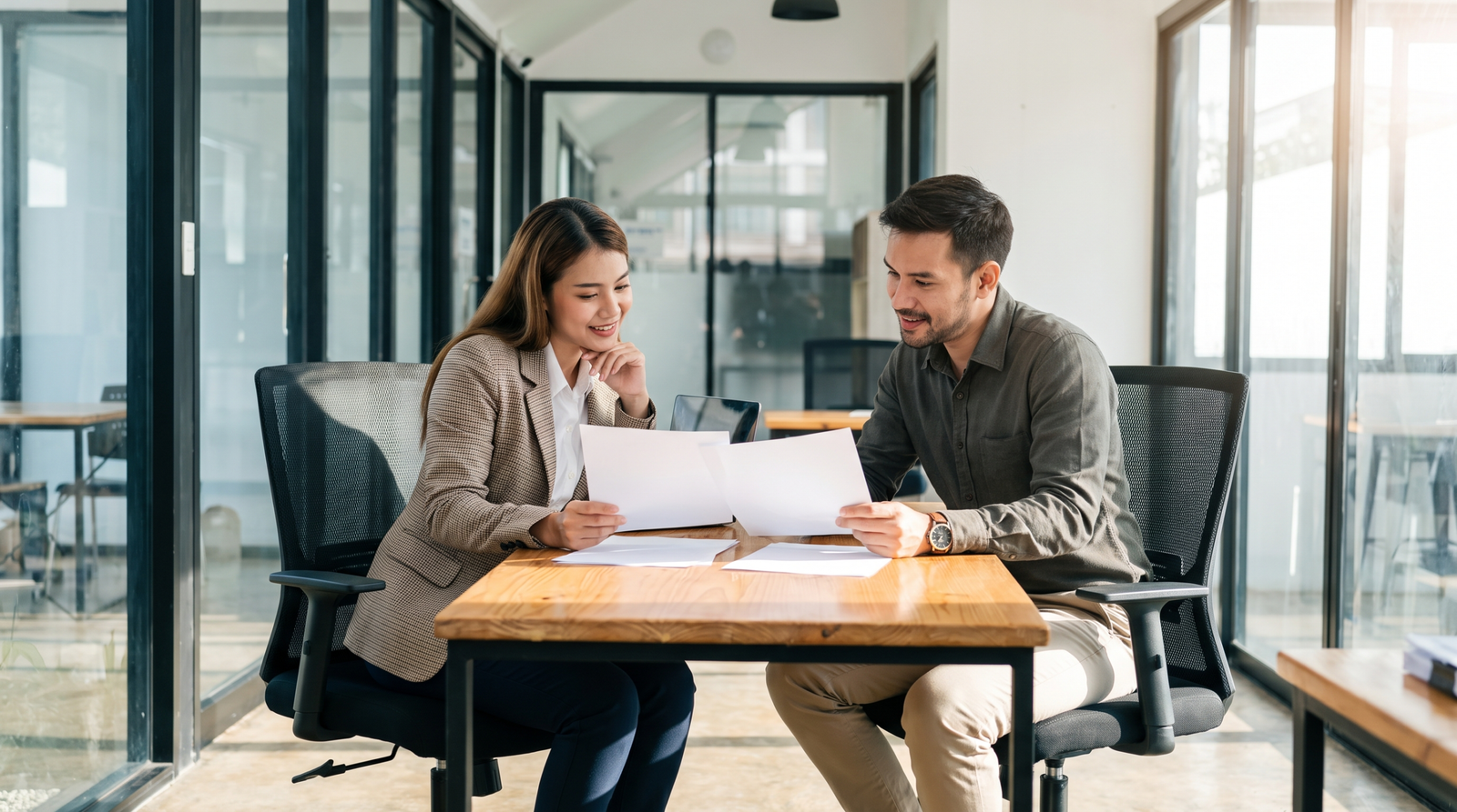 HR manager and employee discussing documents